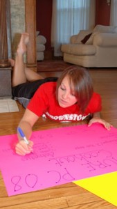 Maggy Younger, a sophomore and new pledge at the Maclure house, works on a poster advertising the house’s bake sale. The money raised will be used to help buy paint to repaint the house’s kitchen and replace countertops. Younger is from Brownstown.
