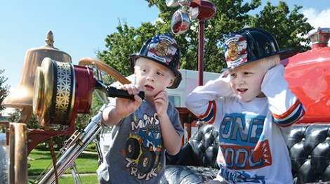 Kao Brown, right, covers his ears as little brother Ambrotin cranks up the siren on Warsaw’s 1920 fire truck on display at Family Safety Day. The boys, ages 5 and 4, were attending with their mom, Alisha Brown, of Warsaw. The event is presented by the Warsaw-Wayne Fire Territory in Kosciusko County and is sponsored by Kosciusko REMC.