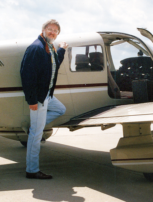 Richard Hertel stands beside his plane. His first date with Mary, the woman he’d marry, was a plane ride. 