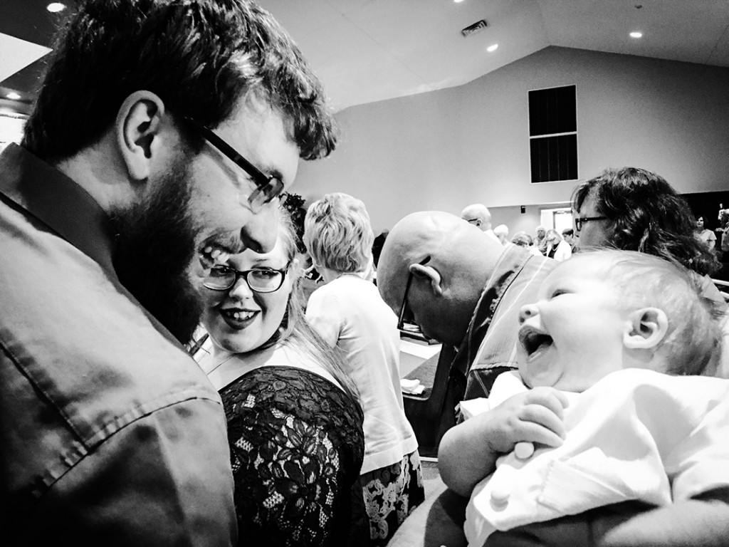 At first, Kathie Ponder's son was afraid to take his newborn to church for fear of him crying. But here, Steven (infant) and dad Brenden Ponder smile at church.
