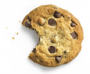 Chocolate Chip Cookie with bite on white