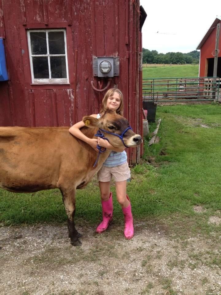 Cheyenne with her jersey cow, Buttercup.