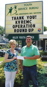 Executive Director Steven Bernth of Youth Services Bureau Big Brothers/Big Sisters of LaPorte receives an Operation Round Up grant check from KVREMC’s Amanda Steeb.