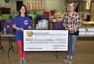 Blessings in a Backpack is one of three local organizations that received an Operation Round Up grant. Blessings in a Backpack will use the funding to provide food to children. Robin Neidig, left, and Christine Garner are pictured. 