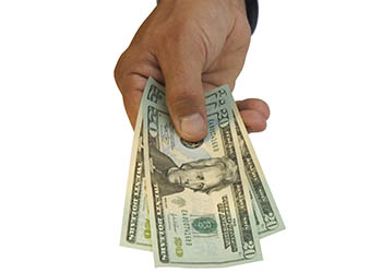 Photo of hand holding money