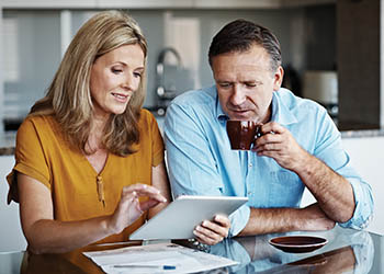 Man and woman on tablet