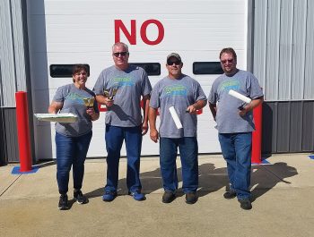 Decatur County REMC employees performing a community service project by painting