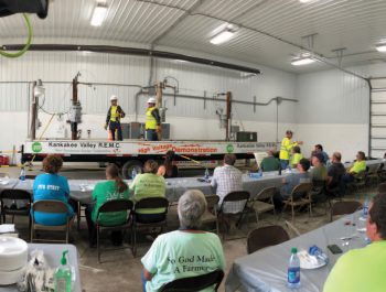 Employees performing a safety demonstration for Kankakee Valley REMC safety day