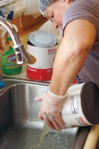 Volunteer helps prepare a meal