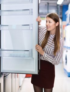 Person looking into a refridgerator