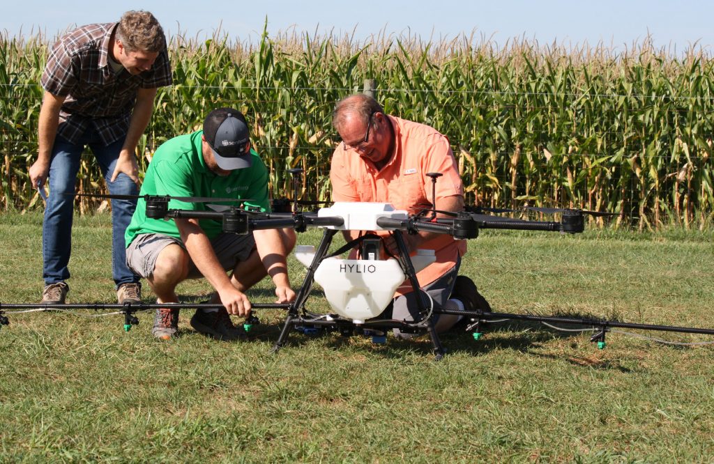 Photo of Jim Love and others with a drone.