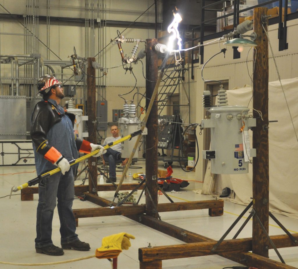 Picture of a LaGrange County REMC lineman performing a high voltage demonstration