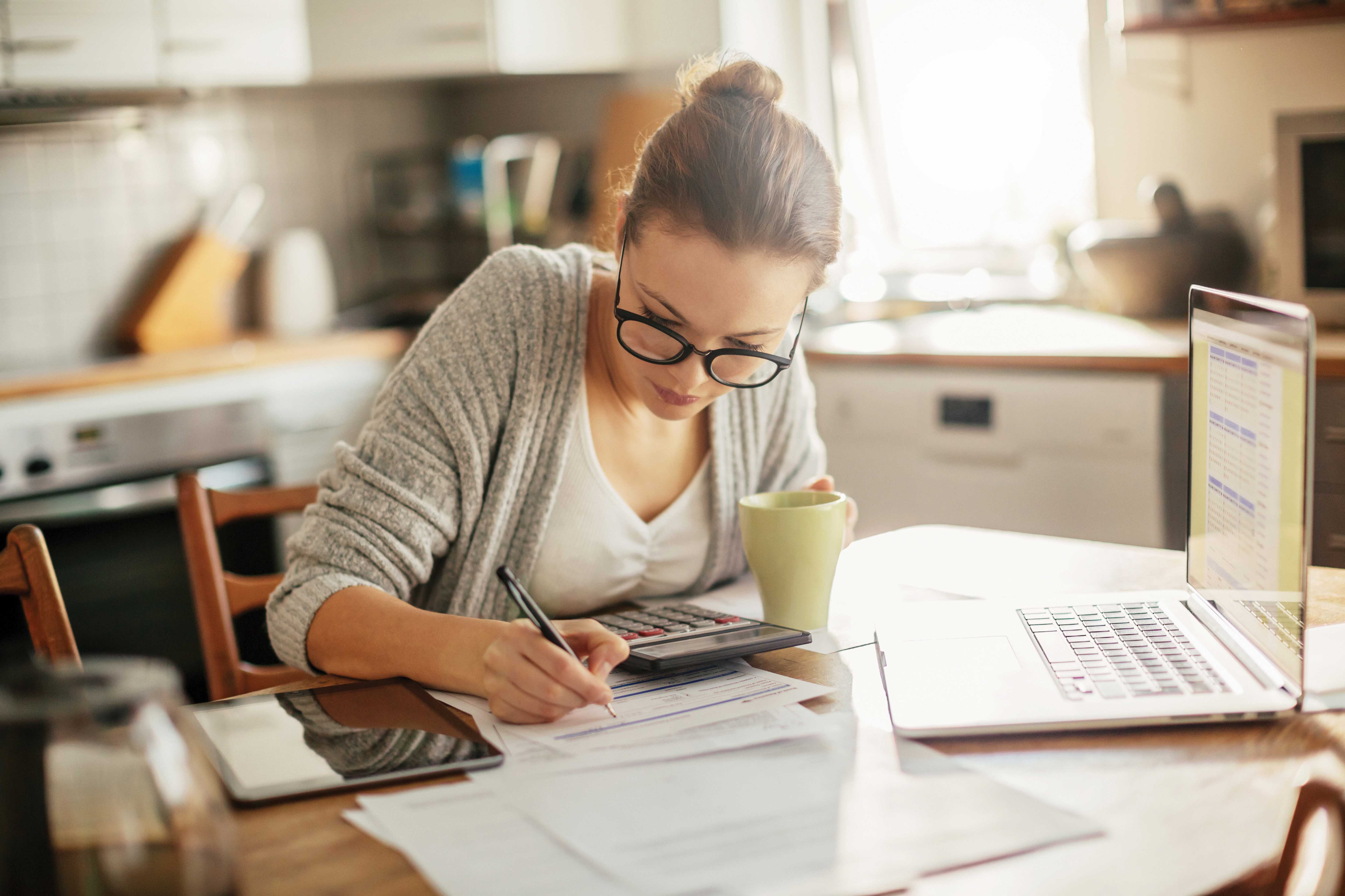 Woman figuring her bill