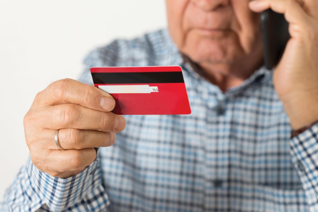 Photo of man with credit card