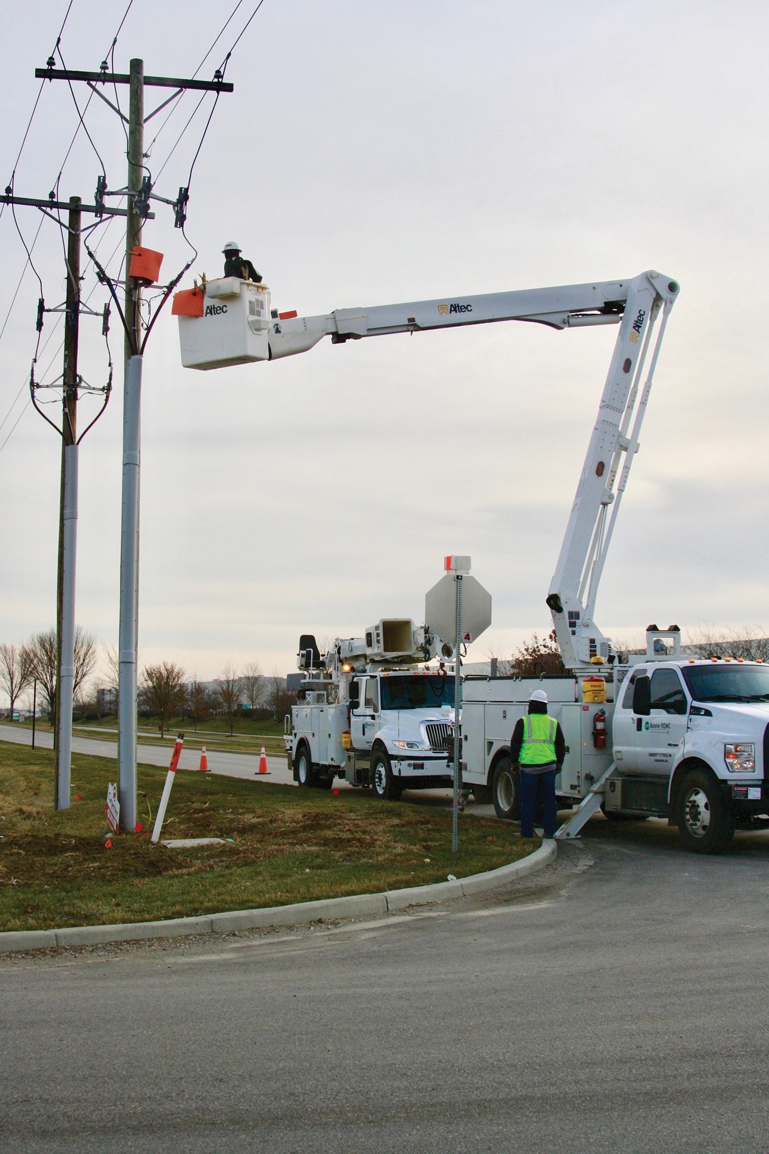 Linemen working on a power pole