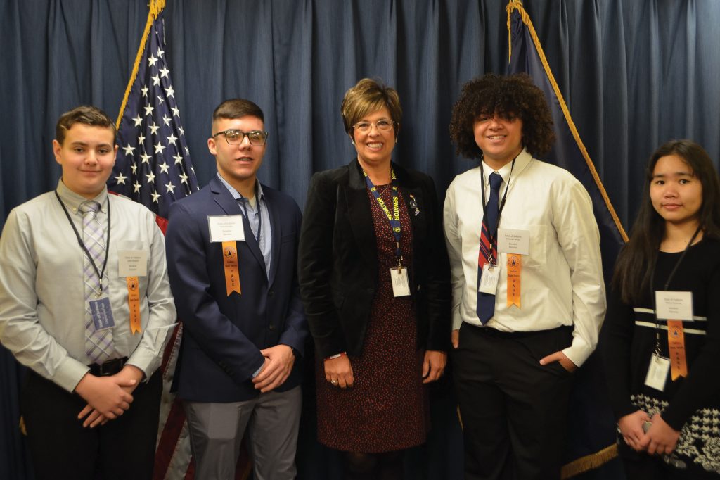 Photo of Page Day students with State Rep. Stacey Donato.