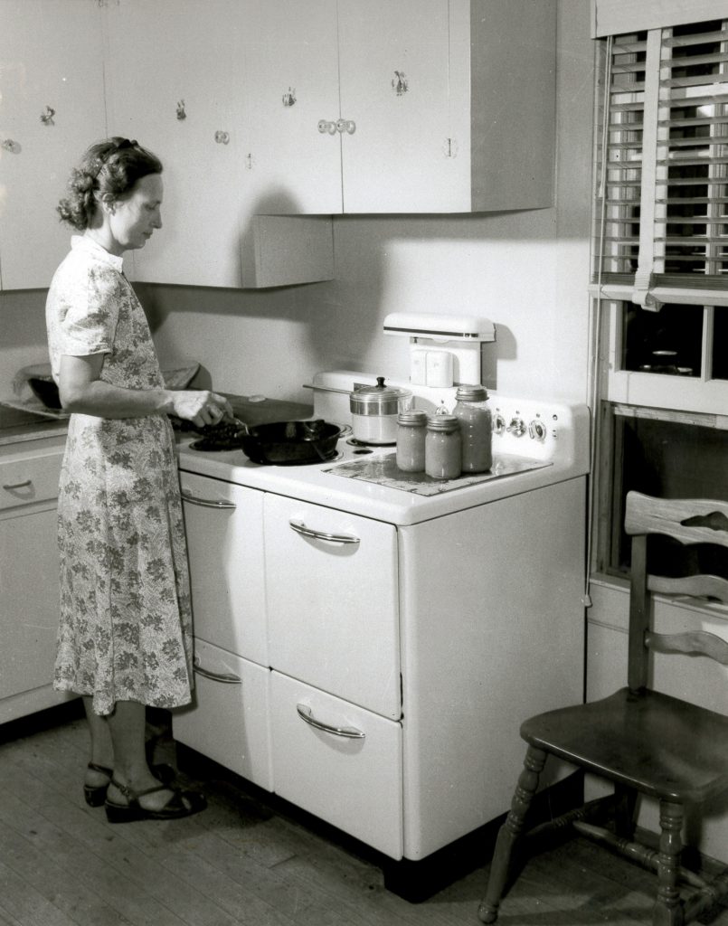 Woman cooking on electric stove
