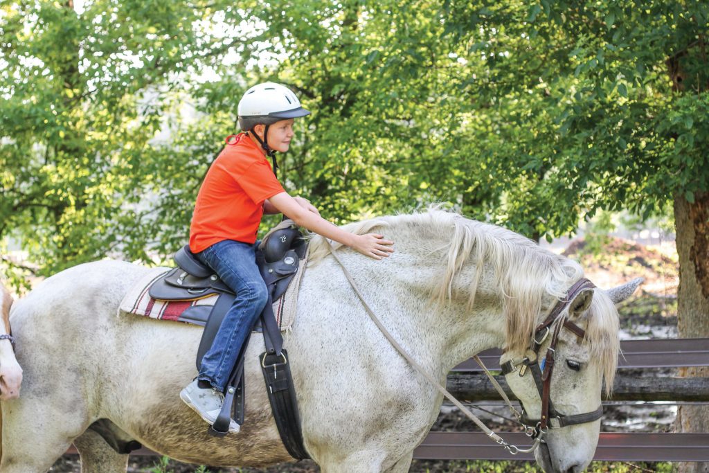 Student on a horse at Touchstone Energy Camp