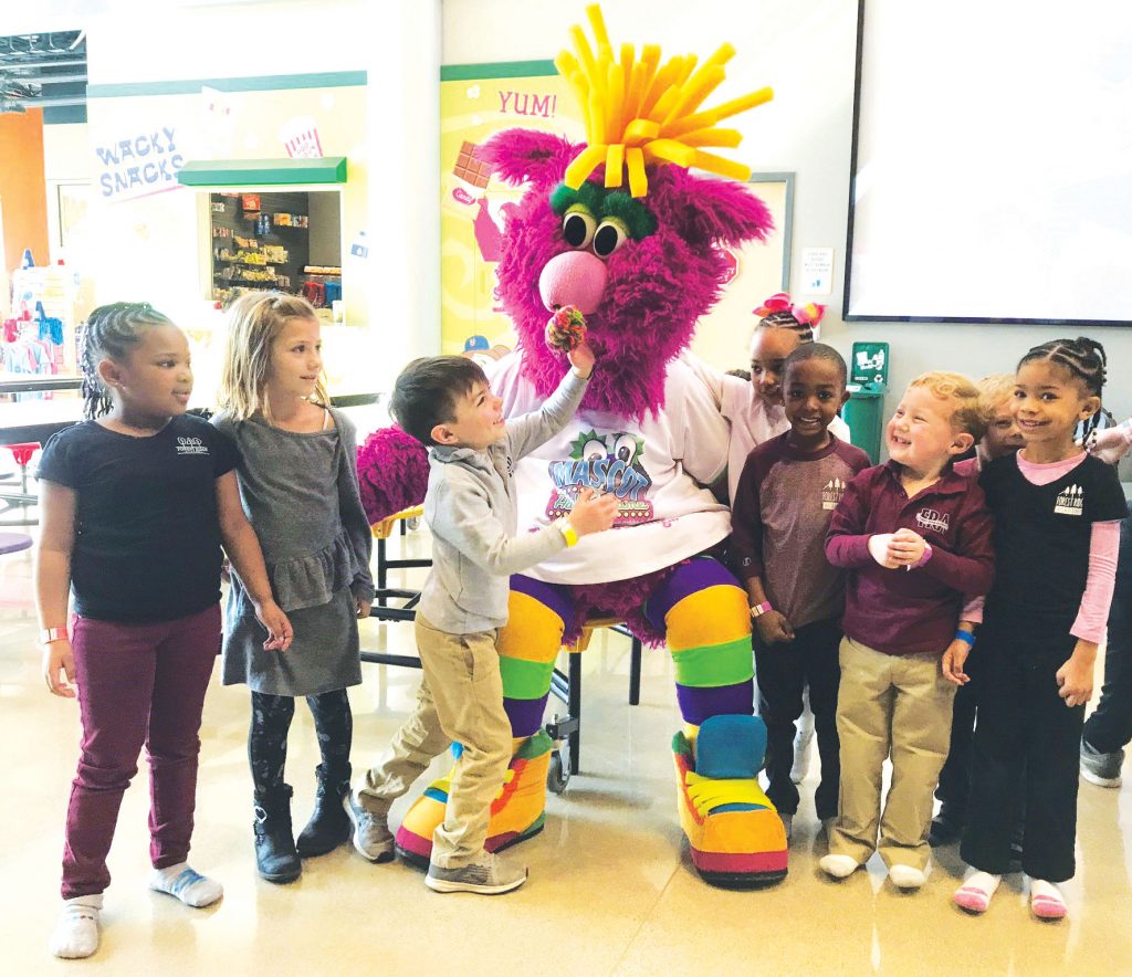 Kids with an unidentified mascot