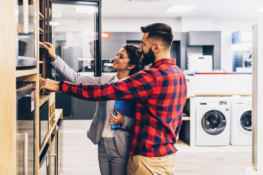 People looking at buying an appliance