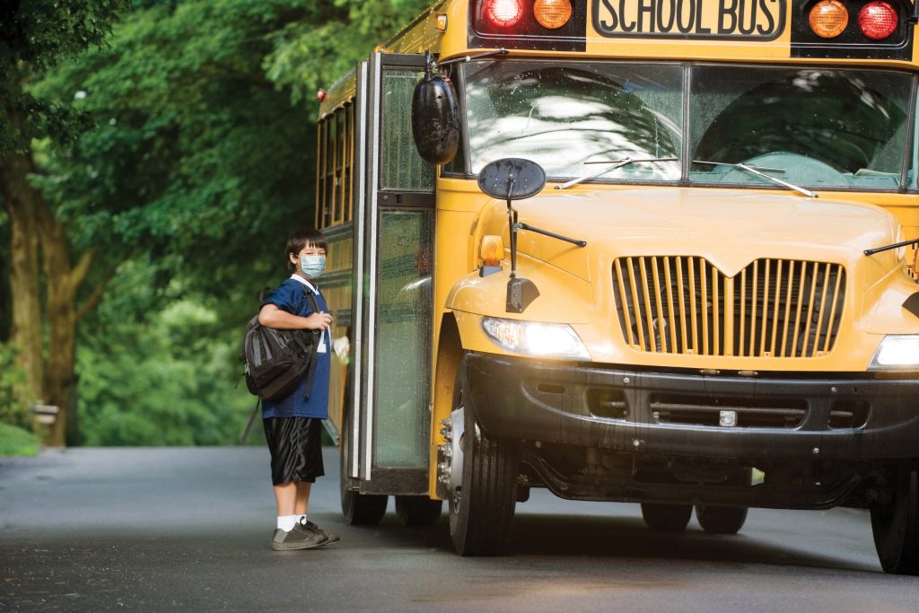 Student getting on school bus