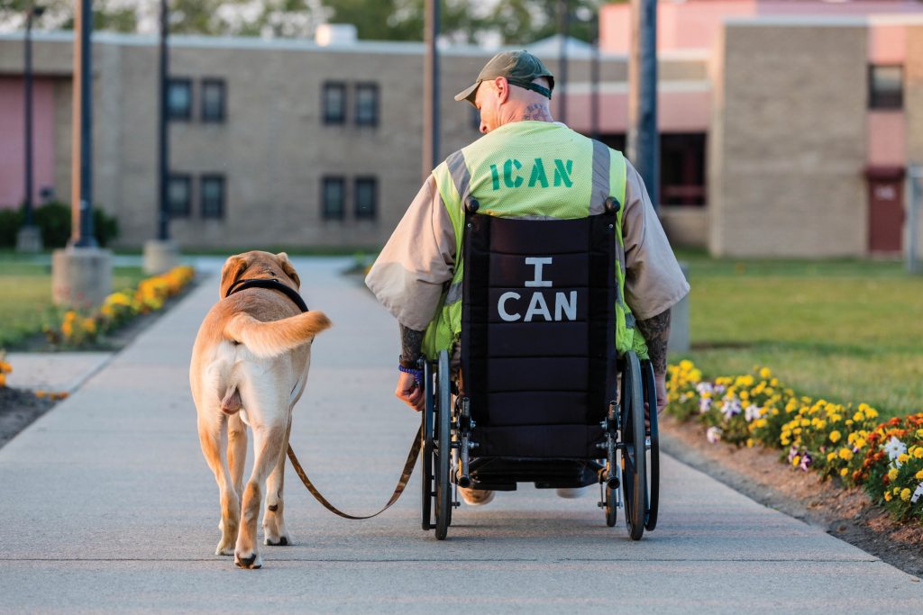 Man in wheelchair with dog
