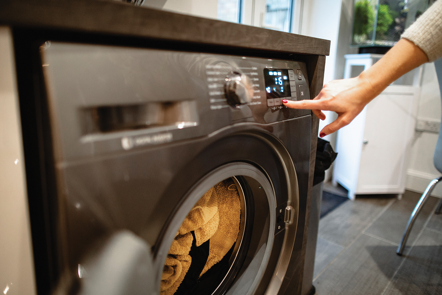 Photo of woman operating a dryer