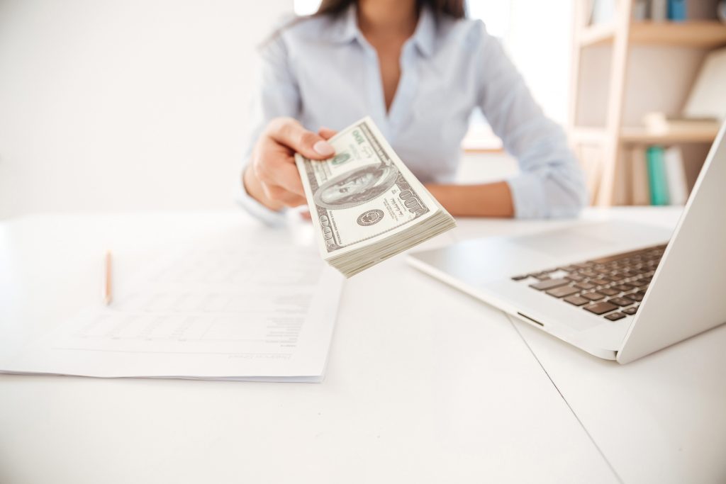 Woman giving out money