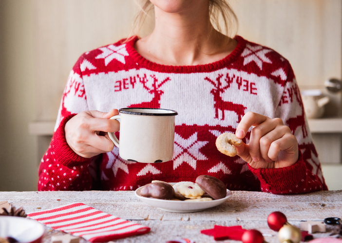 Woman with coffee and cookies