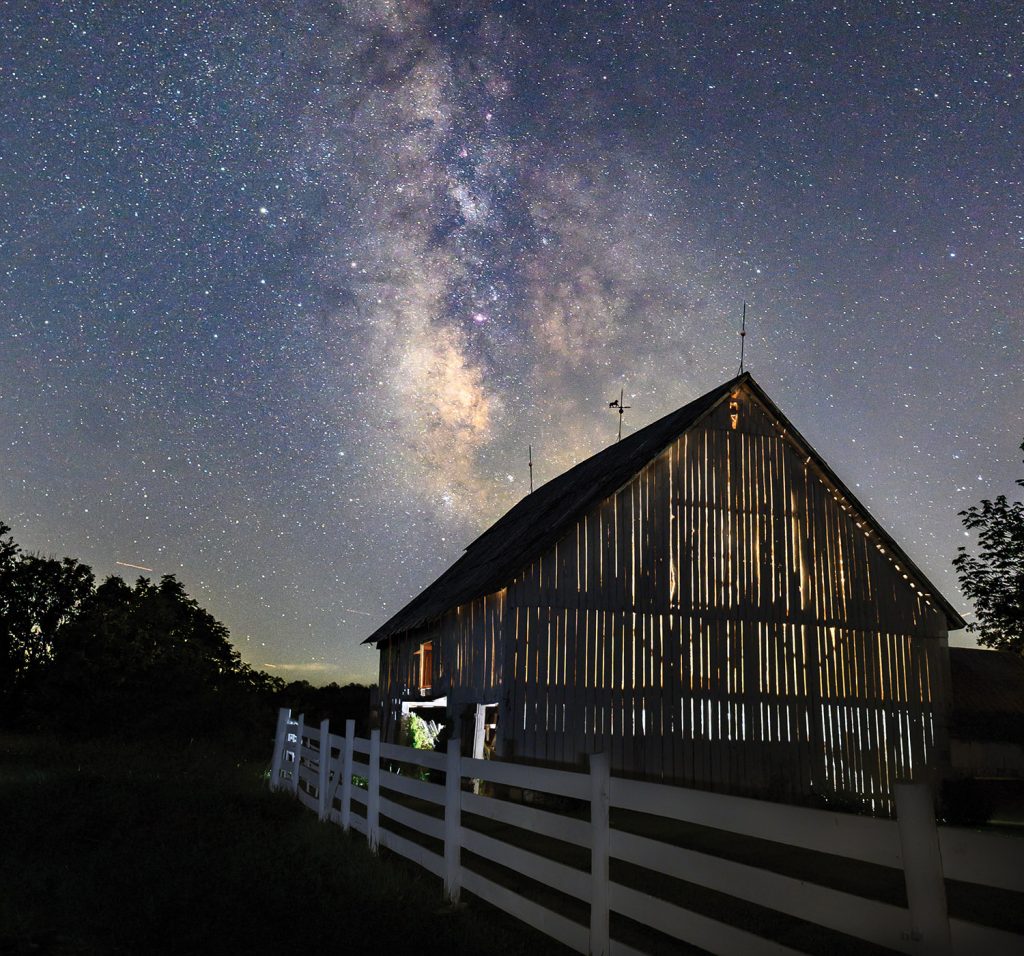Barn in Monroe County against a stary backdrop