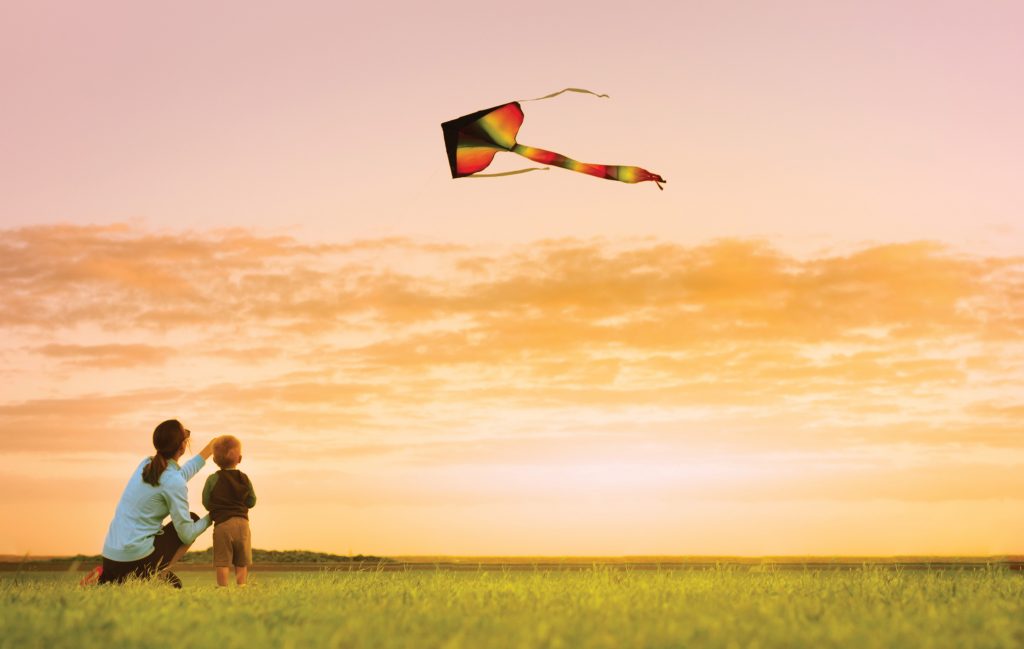 Mother and son flying a kite