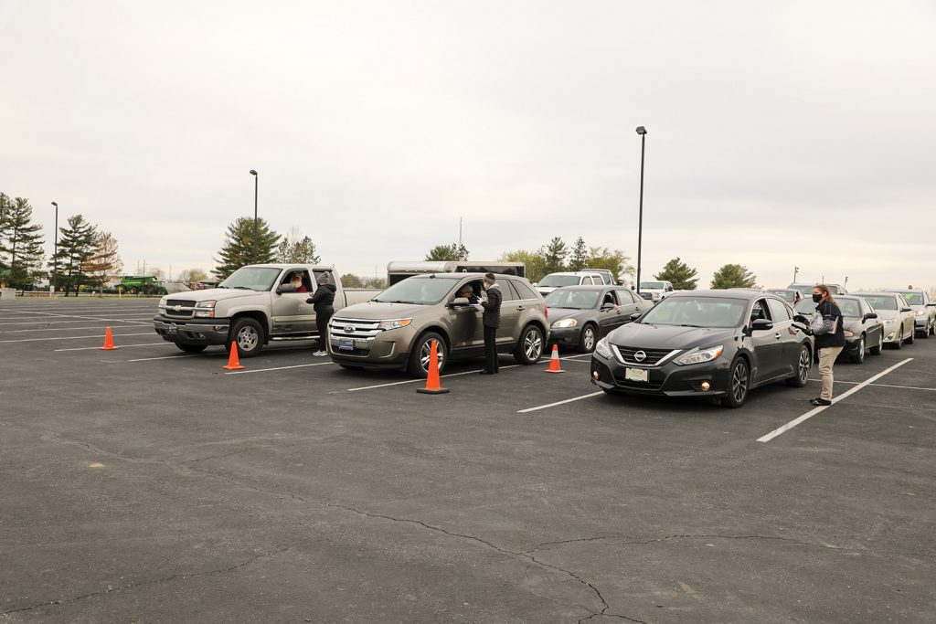 Employees registering vehicles at annual meeting