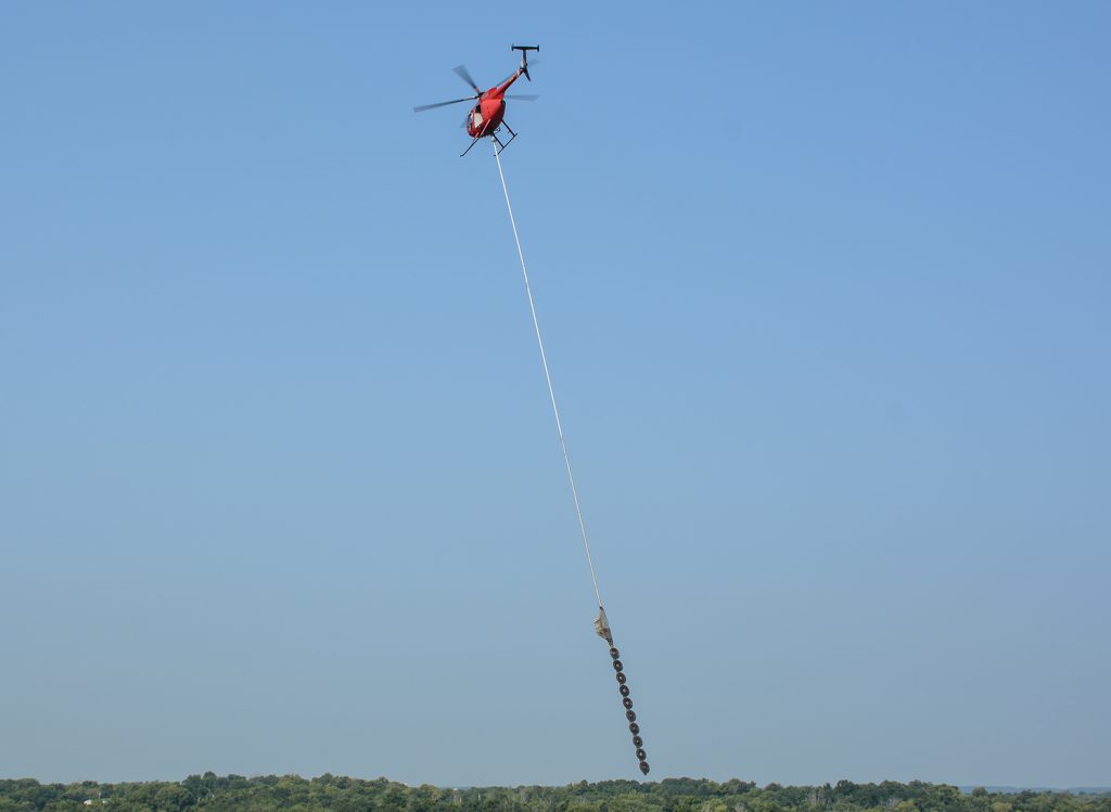 Helicopter doing tree trimming