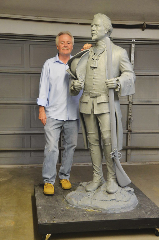 Bill Wolfe stands with his interpretation of François-Marie Bissot, Sieur de Vincennes, for the riverwalk in Vincennes.