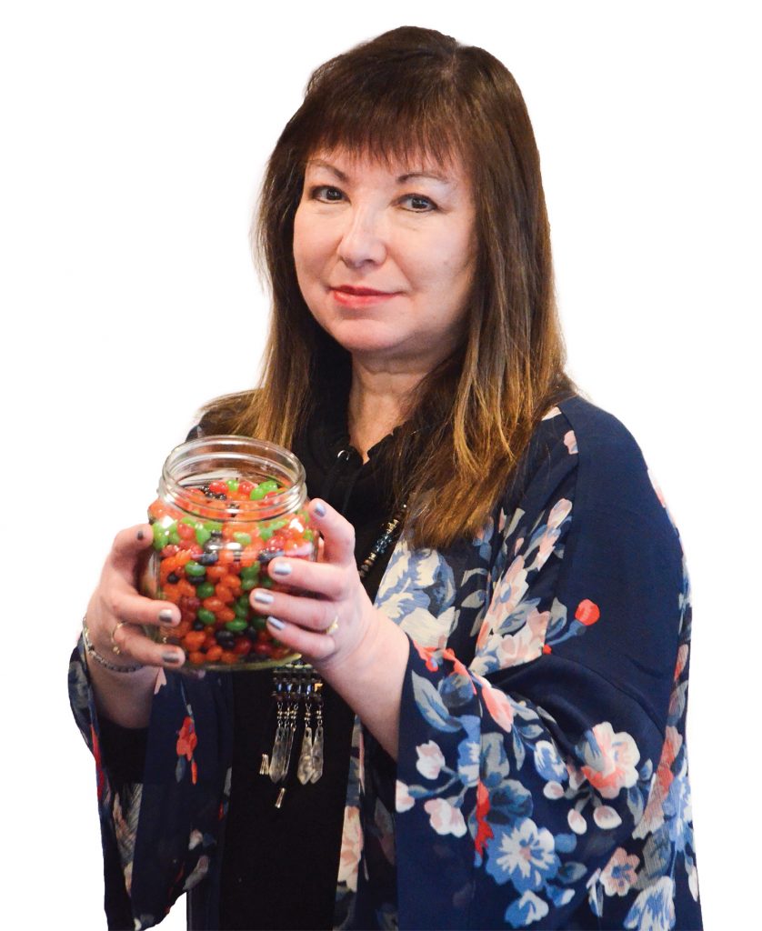 Emily with jar of jelly beans