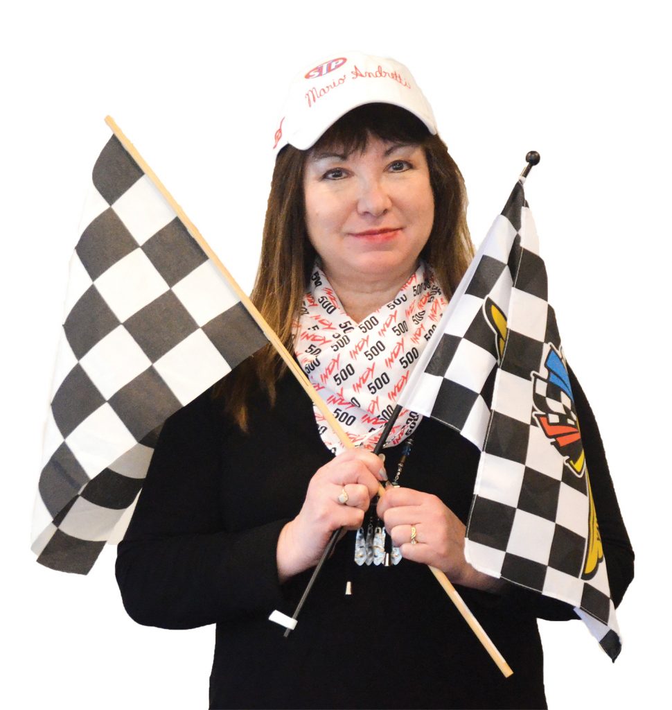 Emily holding checkered flags