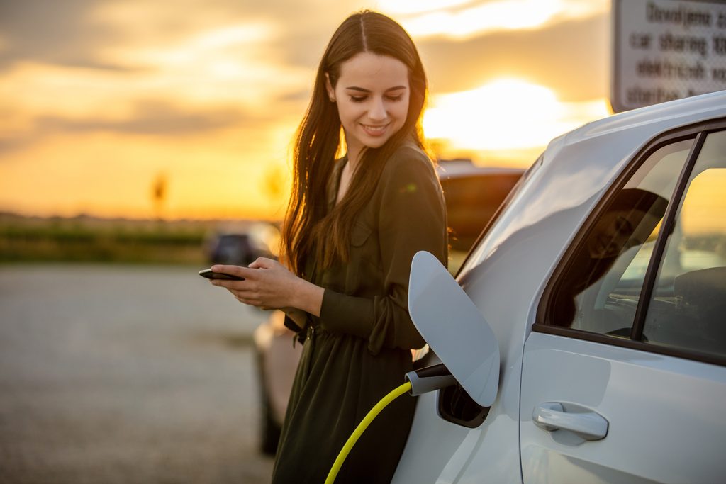 Woman with electric vehicle