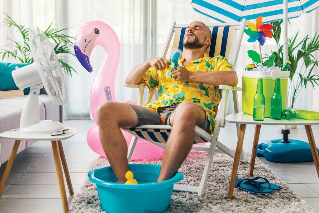 Man cooling himself with a fan