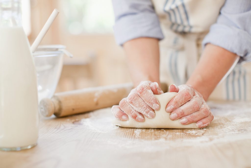 Woman kneeding dough