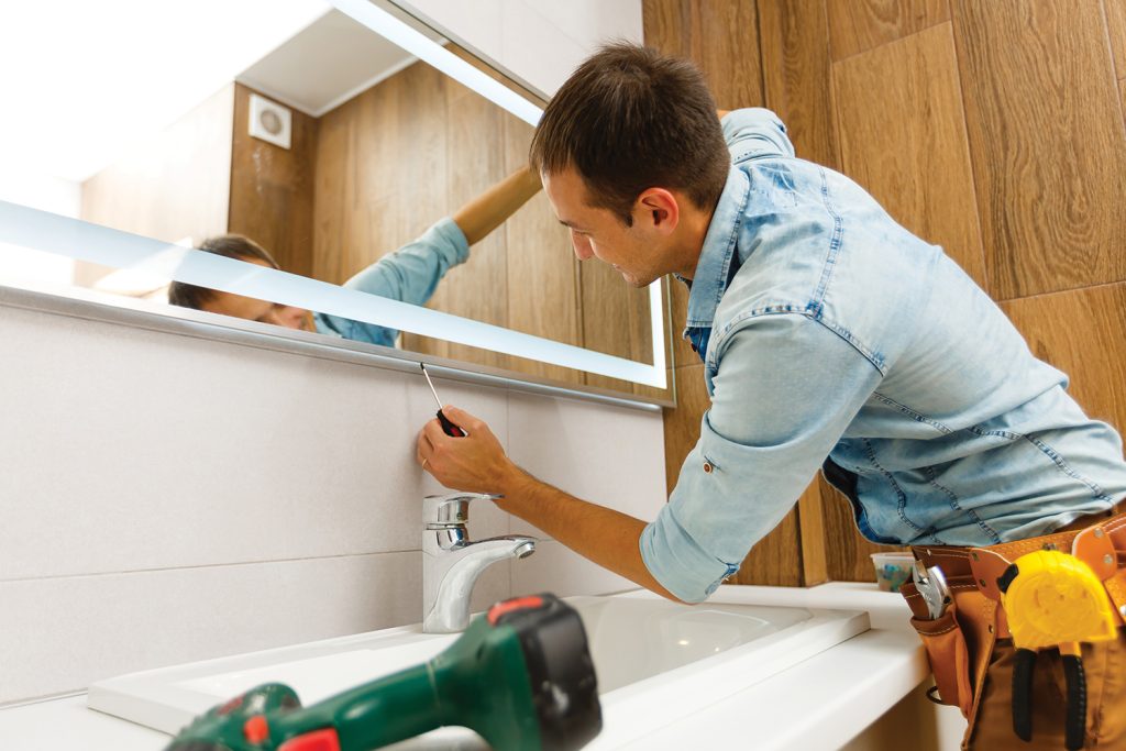 Man renovating bathroom