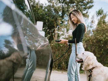 Woman with an electric vehicle