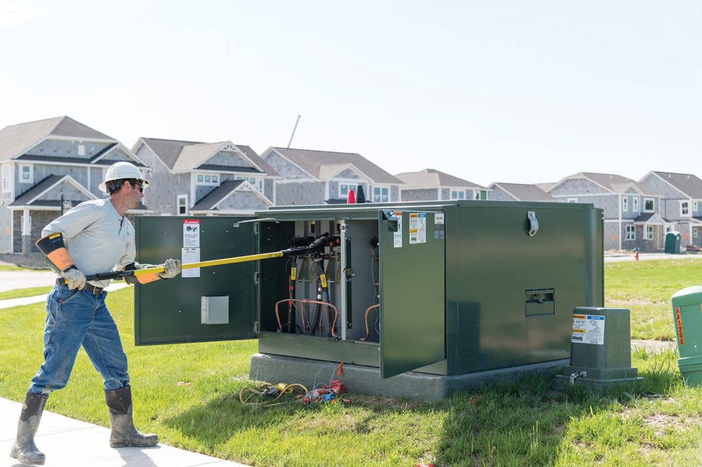 BOONE REMC employee working on a pad mount transformer