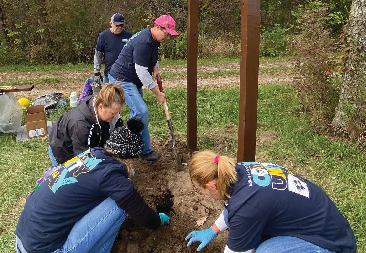 Jay County REMC employees plant flower bulbs at New Mt. Pleasant Cemetery.