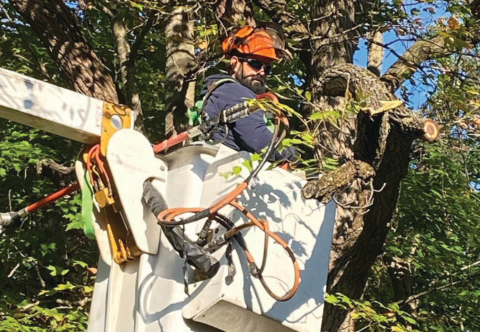 Jay County REMC’s Justin Fennig helps out in a bucket truck during Cooperative Community Day.