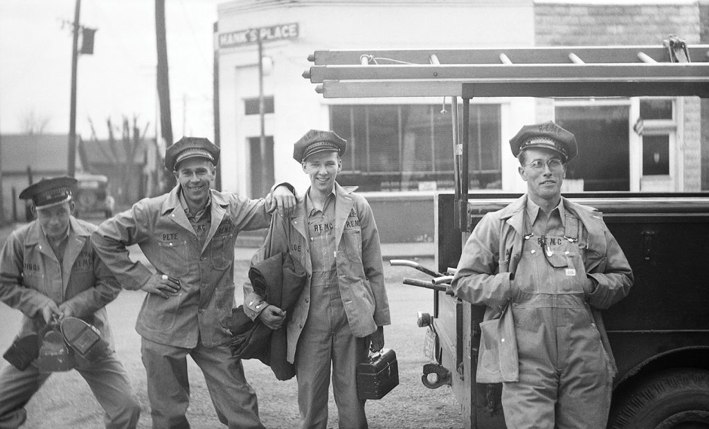 Mid-1940s lineworkers enjoy a good laugh before heading to the jobsite.