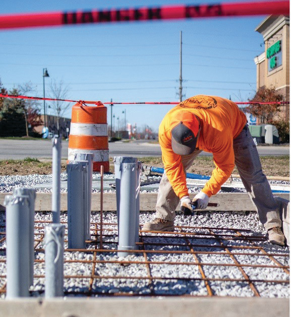 A contractor prepares for a concrete pour for the GOEVIN charger installed in Whitestown, which is served by Boone REMC. Wabash Valley Power Alliance, which is part of GOEVIN, partnered with four member co-ops to install the chargers in their communities.