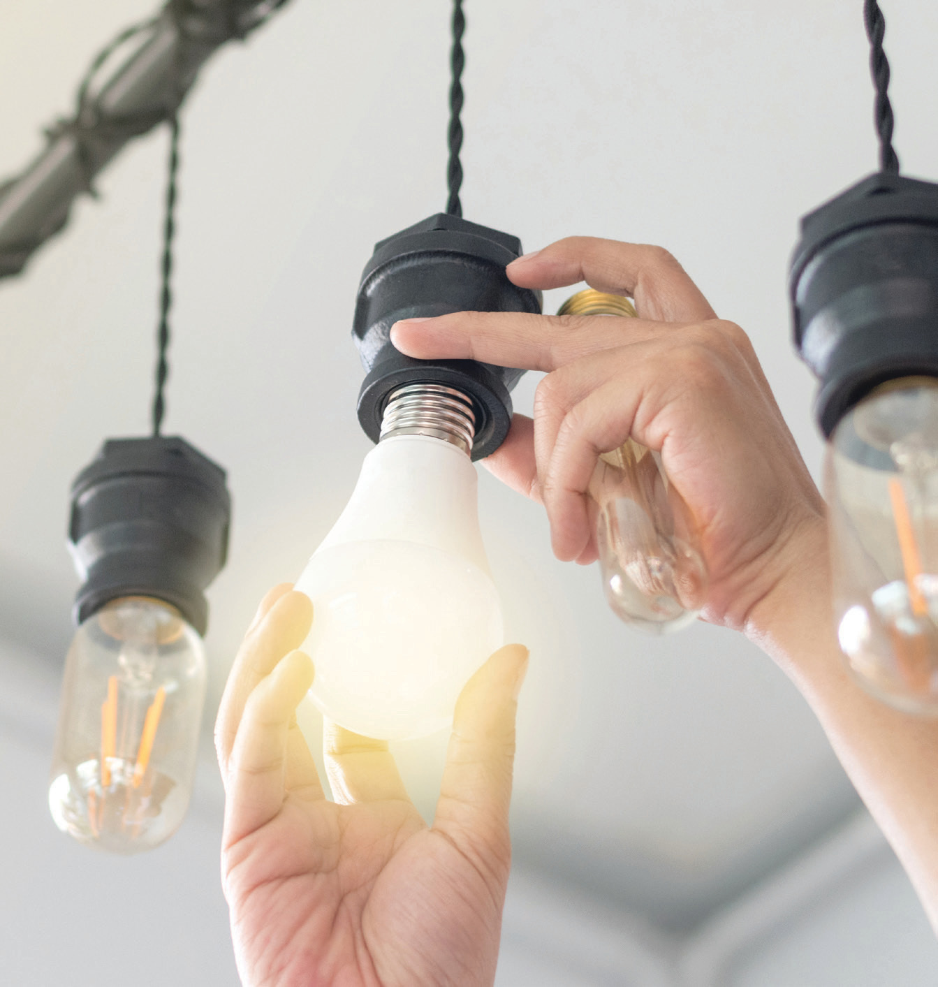 Person changing lightbulb