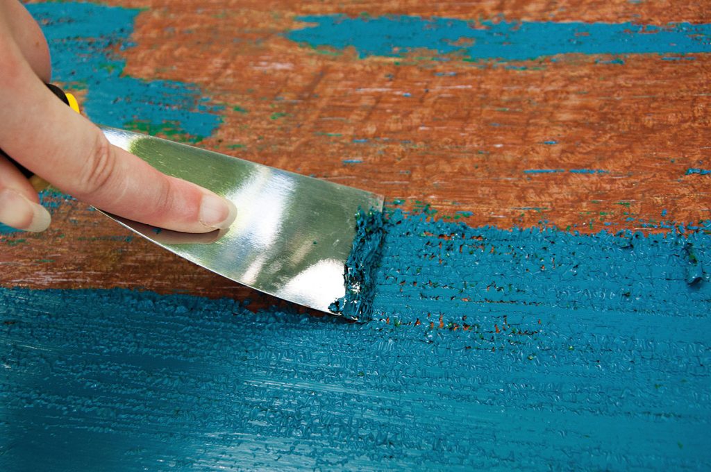 Removing paint with a spatula