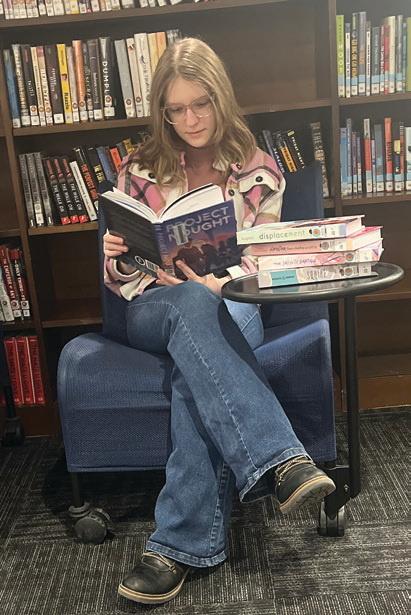 Delphi student reads a book
