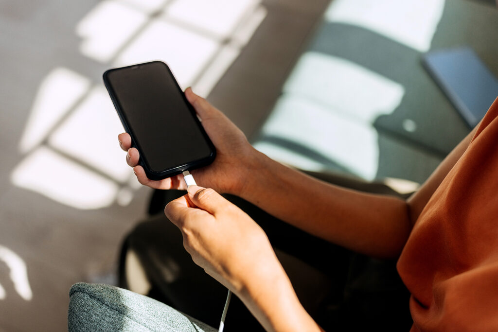 Woman charging a phone